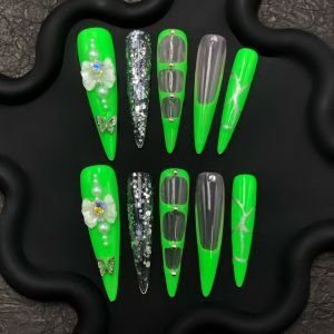 Neon green press-on nails, glow in the dark nails, green butterfly stiletto nails, dramatic long nails