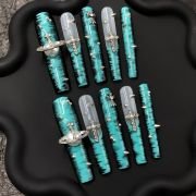 Teal Chrome Cross Press-On Nails with Studs and Planet Charm
